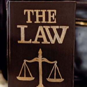 Detailed image of a book titled 'The Law' featuring scales of justice.